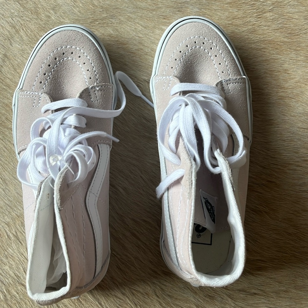 Women’s high top Vans sneakers